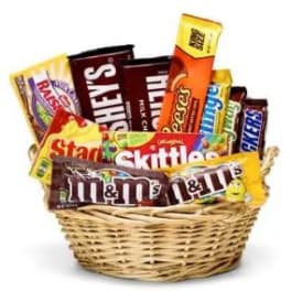Basket filled with assorted candy bars and chocolate packs