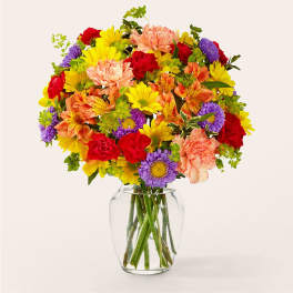 Colorful mixed bouquet in a clear glass vase