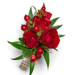 Red rose boutonniere with berries and green leaves