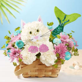 Cat-shaped flower basket with pink and blue blooms in a woven basket