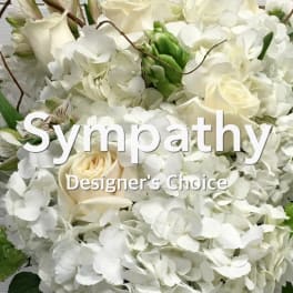 White sympathy bouquet with roses and hydrangeas