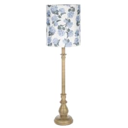 Tall floor lamp with a blue floral lampshade and gold base