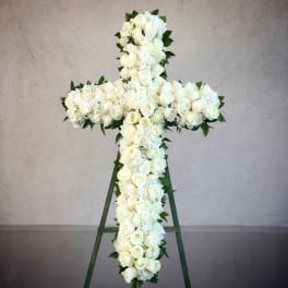 White rose cross on a standing easel