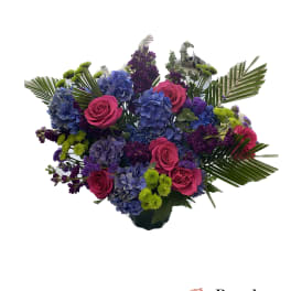 Bouquet of pink roses and blue hydrangeas with purple accents