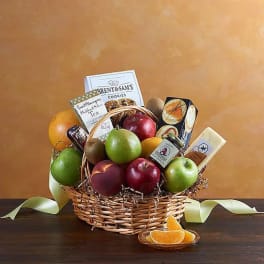Fruit basket with apples, pears, oranges, cookies, tea, and cheese