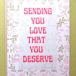 Pink and white greeting card with floral border and text sending you love that you deserve