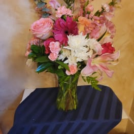 Pink and white mixed bouquet in a clear glass vase
