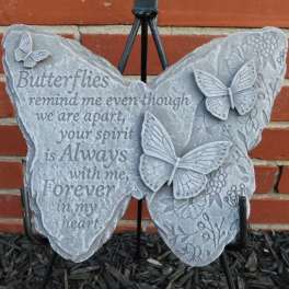 Butterfly-shaped memorial plaque with a sympathy message