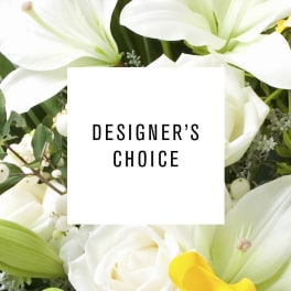 White lilies and roses with a designer's choice label
