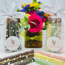 Flower arrangement with pretzel gift bags and chocolate-covered pretzel rods