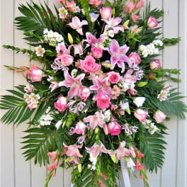 Large pink floral standing spray with lilies and roses