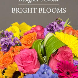 Bright mixed bouquet with roses, calla lilies, sunflowers, and purple blooms