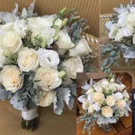 White rose bouquet with pale greenery and a wrapped handle