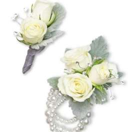 Two white rose boutonnieres with pearl accents on a white background