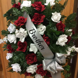 Red and white rose wreath with a "Brother" ribbon and silver bow