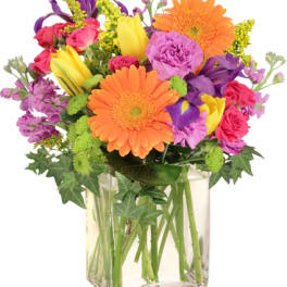 Colorful mixed bouquet in a clear glass vase