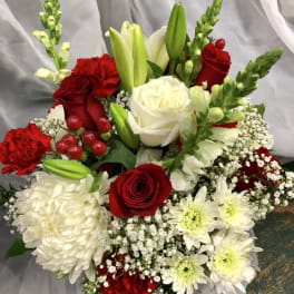 Bouquet of red and white roses with lilies and white daisies
