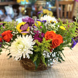 Colorful mixed flower basket with roses and daisies