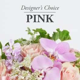 Pink floral arrangement with roses and orchids