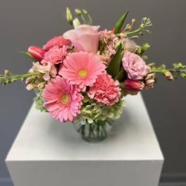 Pink mixed bouquet in a clear glass vase