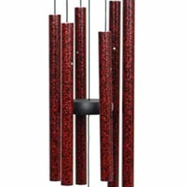 Red metal wind chime with hanging tubes and a round clapper
