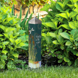 Memorial garden marker among green shrubs with "always with you" text