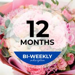 Pink rose bouquet with eucalyptus and a "12 months" subscription label