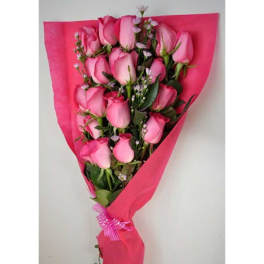 Bouquet of pink roses wrapped in bright pink paper