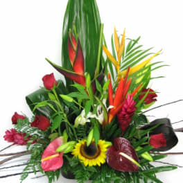 Tropical bouquet with sunflowers, red roses, and anthuriums
