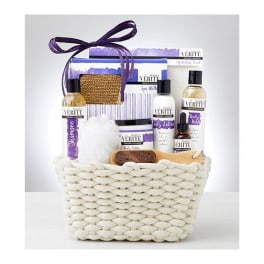 Spa gift basket with bath products in a woven white basket