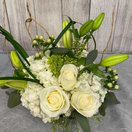 White rose and hydrangea bouquet with green lily buds
