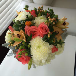 Bouquet of pink roses, white chrysanthemums, and peach lilies