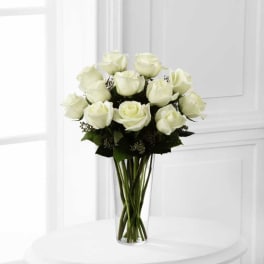 Bouquet of white roses in a clear glass vase