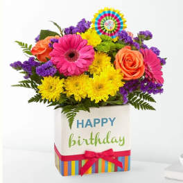 Colorful mixed bouquet in a birthday gift box with a ribbon