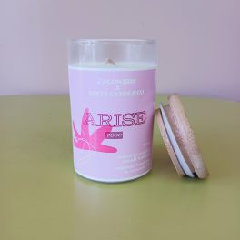 Pink rose candle in a glass jar with a wooden lid