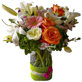 Mixed bouquet of lilies, roses, and gerbera daisies in a glass vase