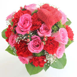 Pink and red rose bouquet with a red heart decoration