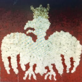 White floral arrangement shaped like a horse on a red background