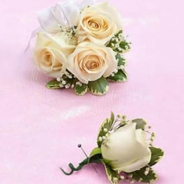 White rose boutonniere and matching wrist corsage on pink background