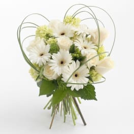 White gerbera daisies and roses in a hand-tied bouquet