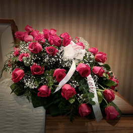 Large bouquet of pink roses with baby's breath and white ribbon