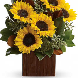 Sunflower arrangement in a rectangular wooden vase