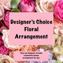 Pink and cream floral arrangement with designer's choice text