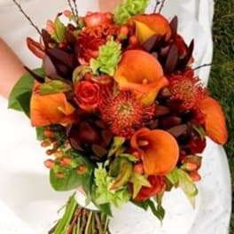 Orange and red bouquet with calla lilies and roses