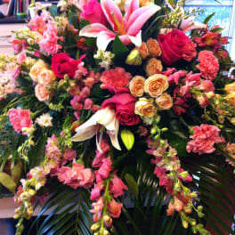 Large mixed bouquet with pink lilies, roses, and carnations