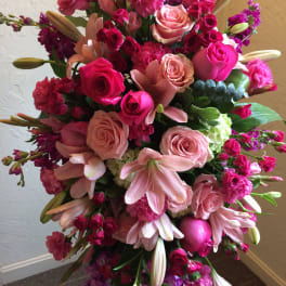 Large bouquet of pink roses, lilies, and carnations