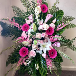 Tall pink and white floral standing spray with lilies and gerbera daisies