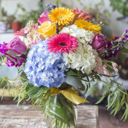 Colorful bouquet of mixed flowers in a glass vase