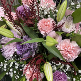 Bouquet of pink and purple flowers with lilies and baby's breath