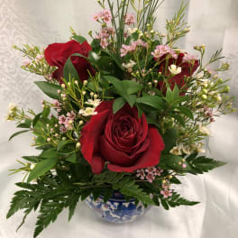 Three roses in ceramic vase